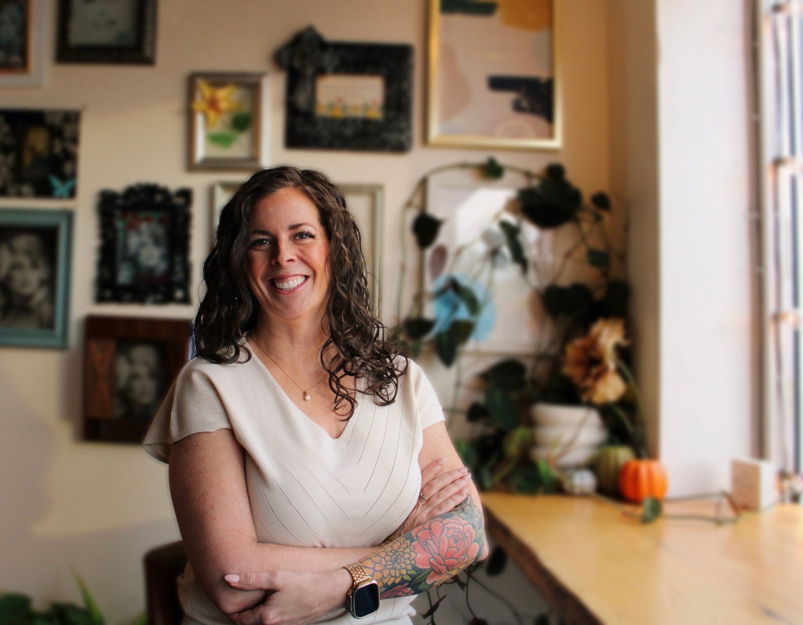 Melissa Benderman smiling beside a sunny window